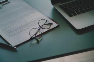 Glasses on notepad.